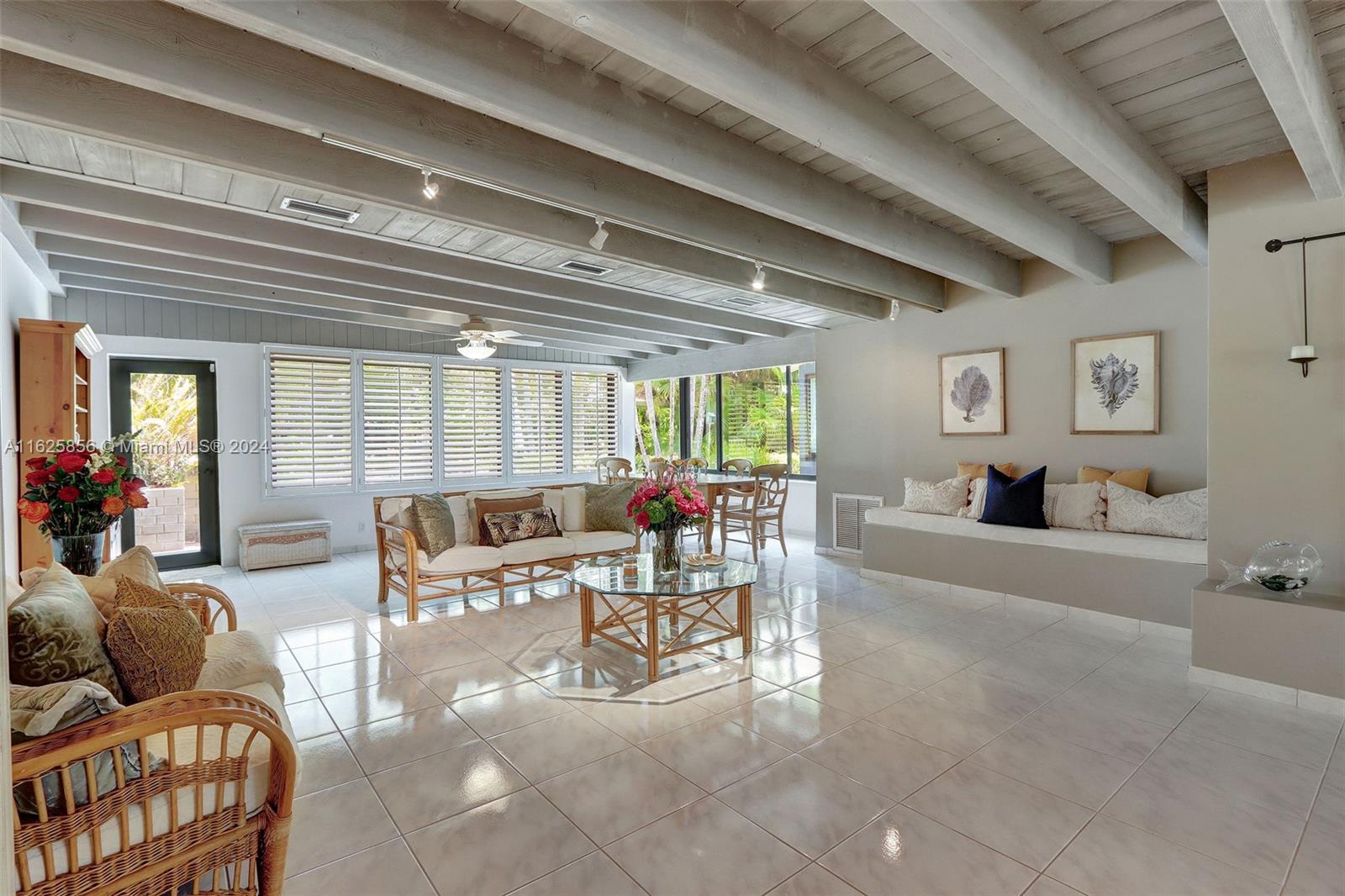 9290 Southwest 117th Terrace Miami, FL 33176 - Photo 5 of 26 a living room with furniture and a wooden floor