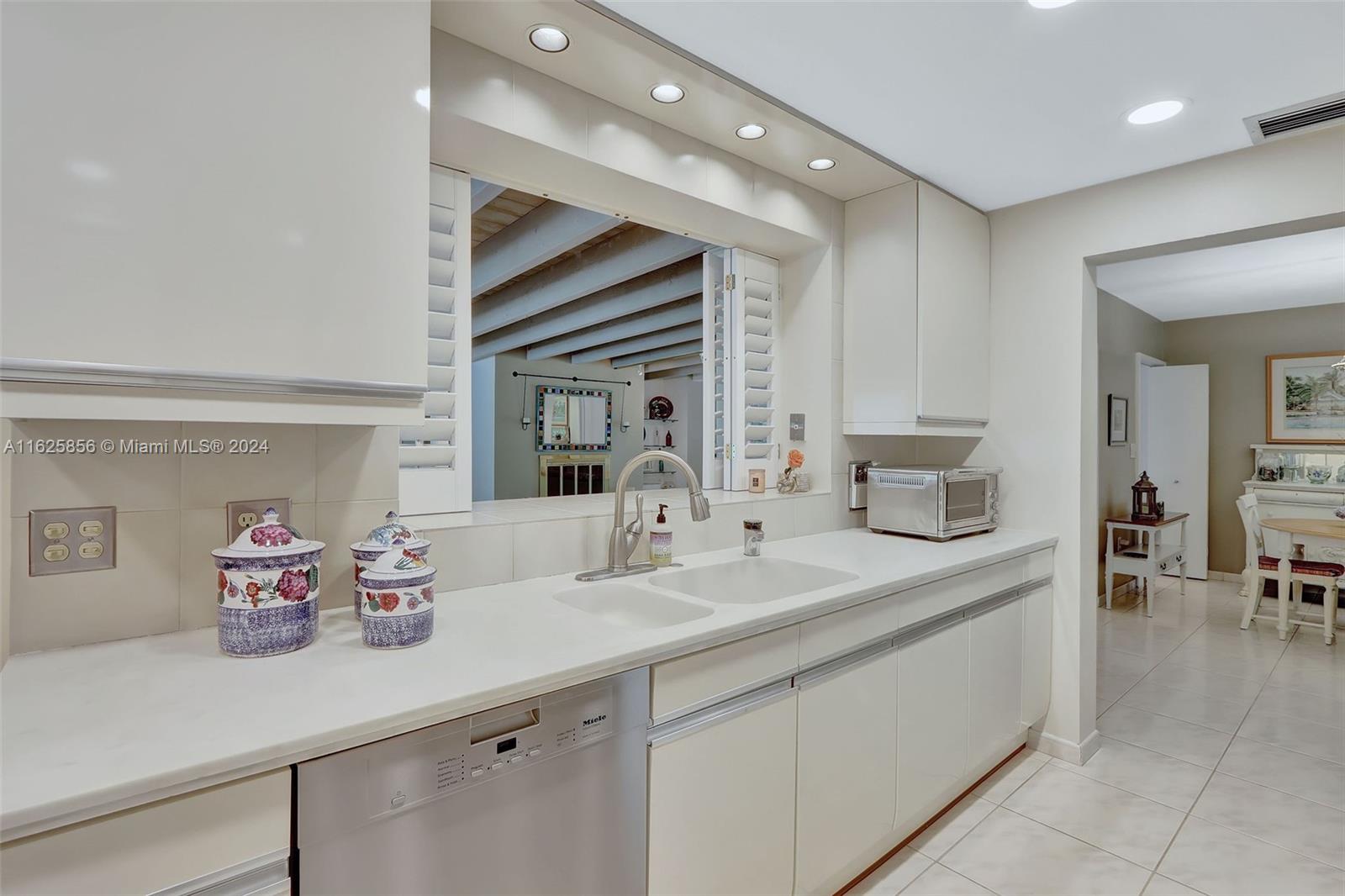 9290 Southwest 117th Terrace Miami, FL 33176 - Photo 8 of 26 a bathroom with a sink double vanity and a mirror