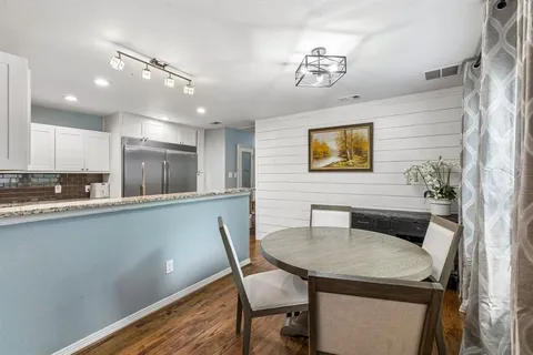 a kitchen with a table and chairs in it