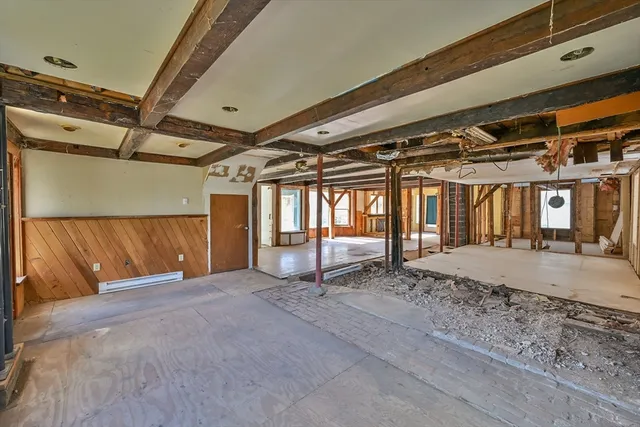 a view of a room with wooden walls