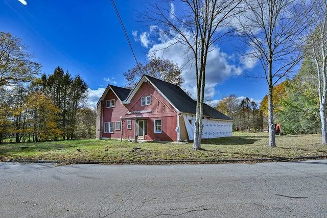 front view of a house with a yard