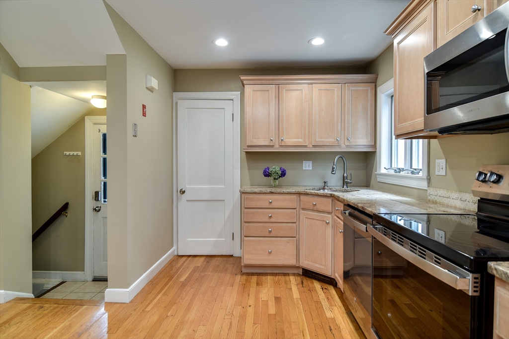 48 Edgebrook Road Framingham, MA 01701 - Photo 13 of 29 a kitchen with stainless steel appliances granite countertop a stove and a sink