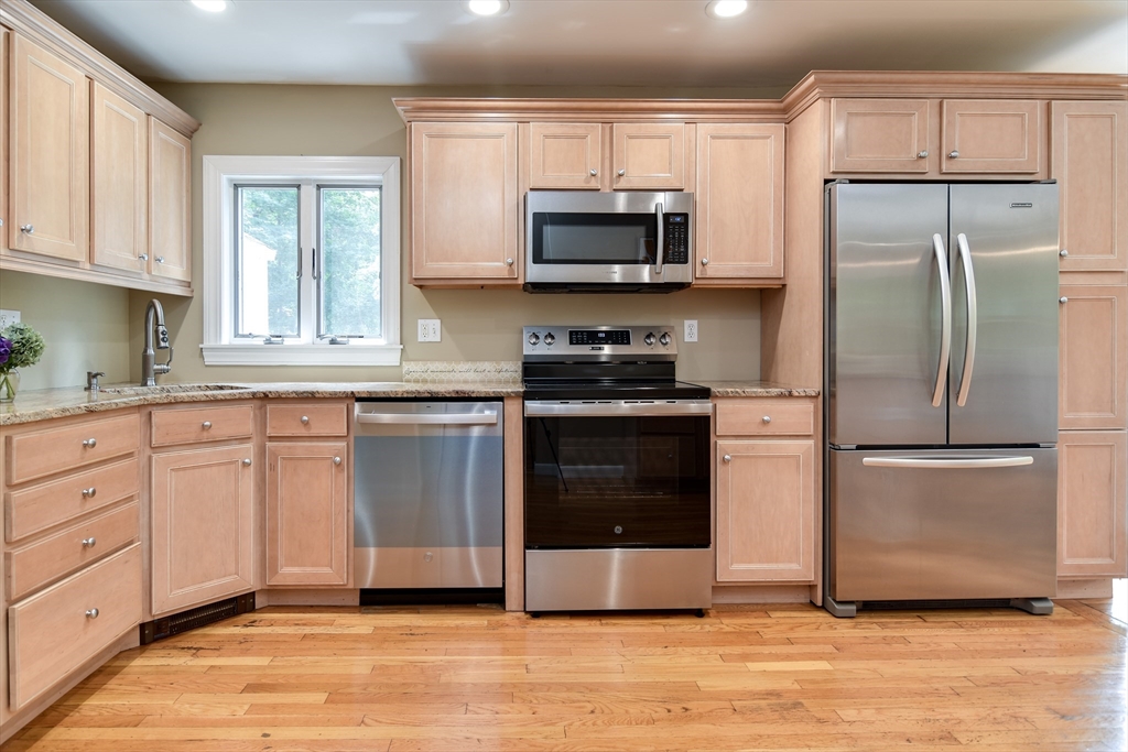 48 Edgebrook Road Framingham, MA 01701 - Photo 15 of 29 a kitchen with cabinets stainless steel appliances and window