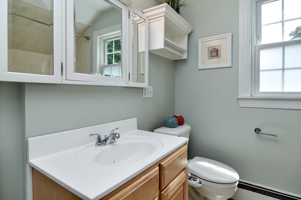 48 Edgebrook Road Framingham, MA 01701 - Photo 18 of 29 a bathroom with a sink a toilet and a window