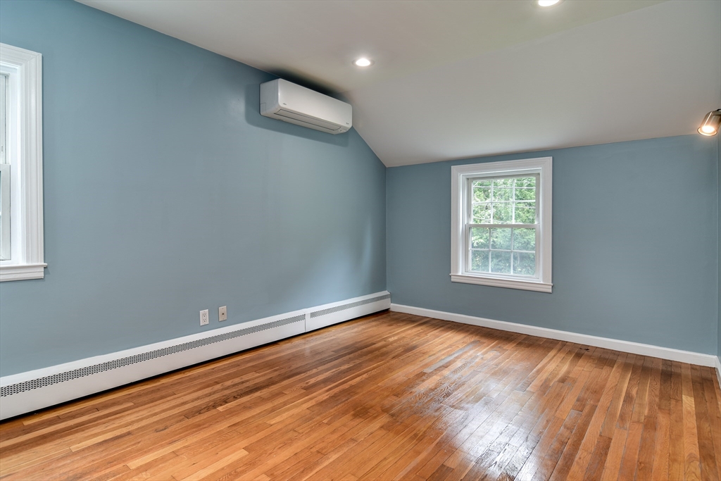 48 Edgebrook Road Framingham, MA 01701 - Photo 19 of 29 an empty room with wooden floor and windows