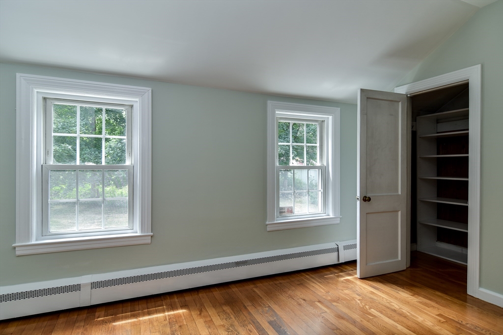 48 Edgebrook Road Framingham, MA 01701 - Photo 23 of 29 a view of an empty room with a window and wooden floor