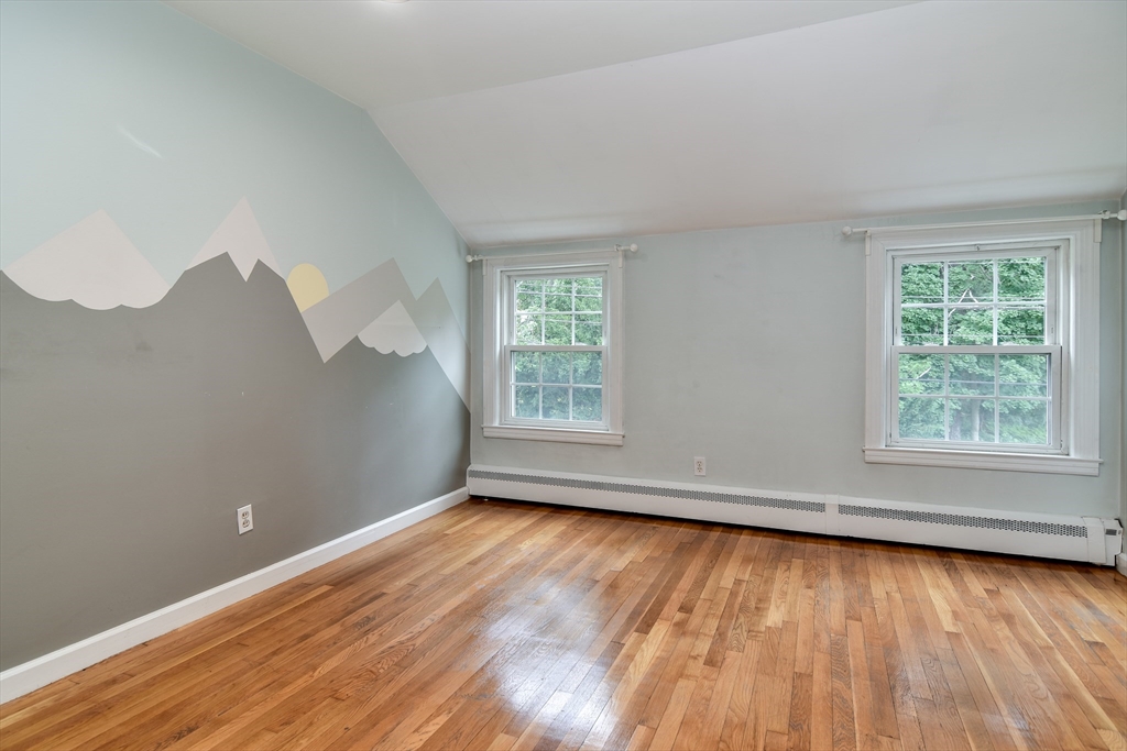 48 Edgebrook Road Framingham, MA 01701 - Photo 24 of 29 a view of an empty room with wooden floor and a window