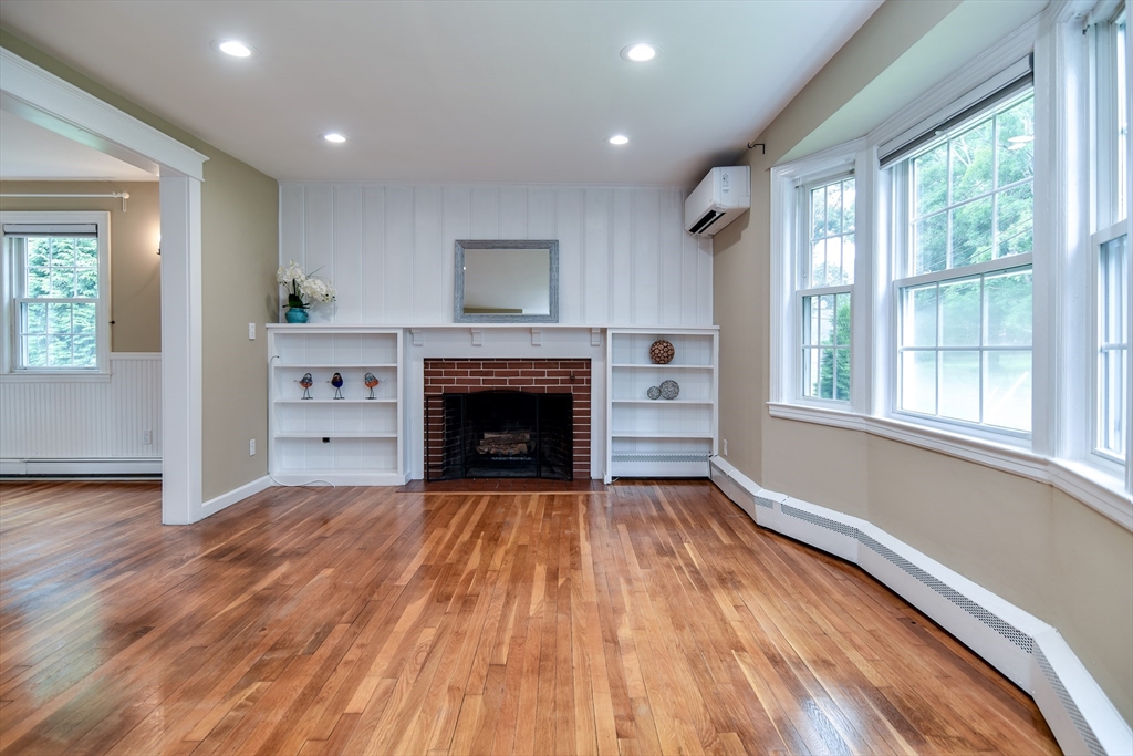 48 Edgebrook Road Framingham, MA 01701 - Photo 3 of 29 a view of empty room with wooden floor and fireplace