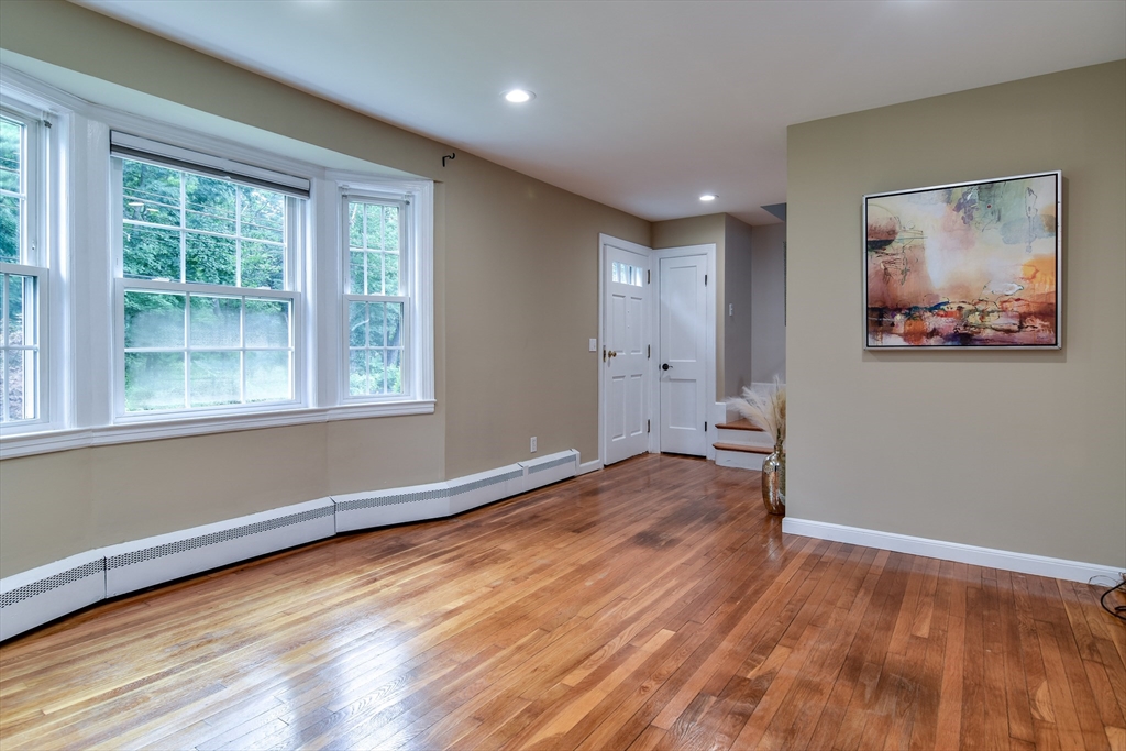 48 Edgebrook Road Framingham, MA 01701 - Photo 5 of 29 a view of empty room with wooden floor and fan