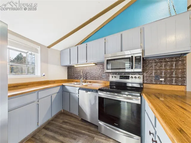 a view of a living room with a ceiling fan