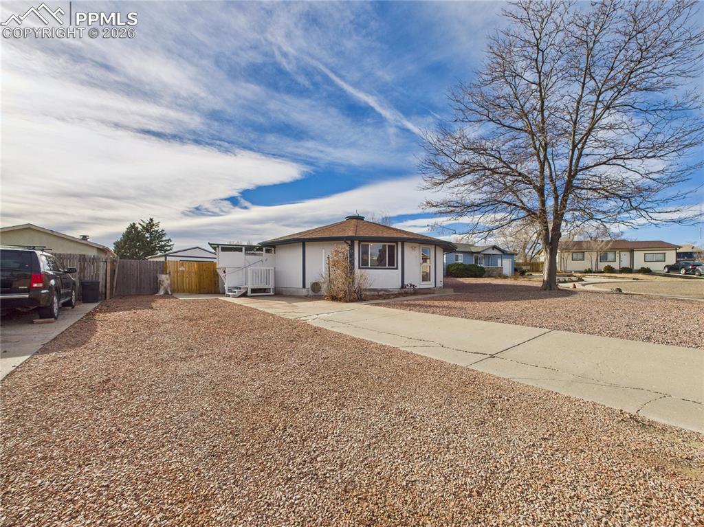 4 Bridgeport Circle Pueblo, CO 81003 - Photo 2 of 42 a front view of a house with a yard and garage