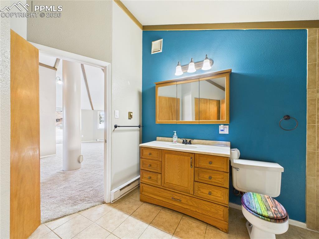 4 Bridgeport Circle Pueblo, CO 81003 - Photo 21 of 42 a bathroom with a toilet sink and mirror
