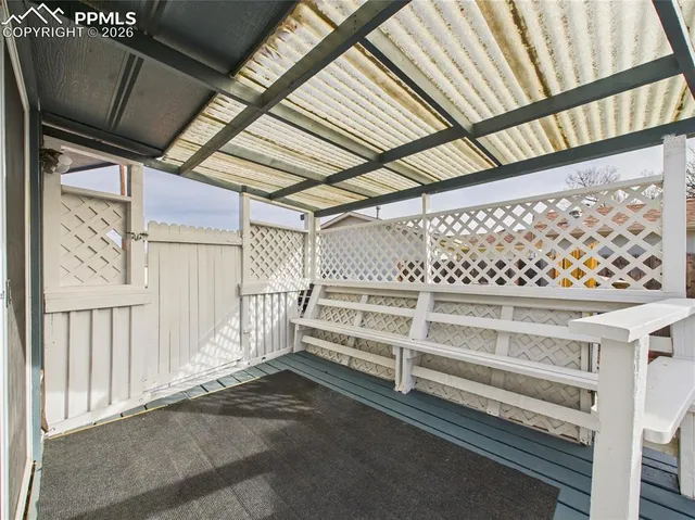 a view of a swimming pool with a porch