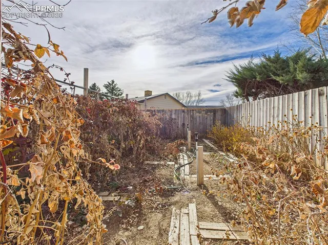 a view of a kitchen with a tub and window