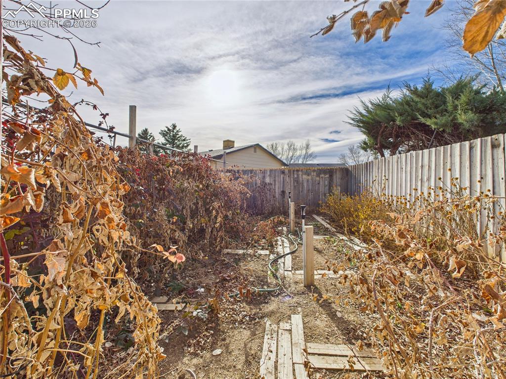 4 Bridgeport Circle Pueblo, CO 81003 - Photo 38 of 42 a view of a dry yard with wooden fence
