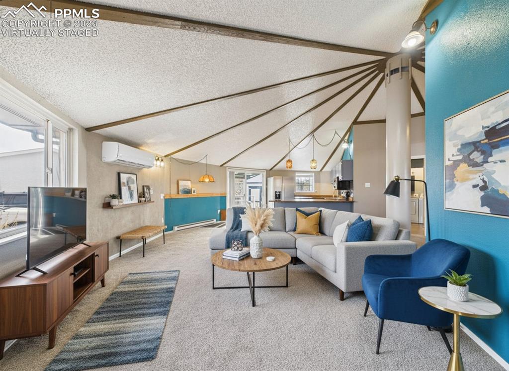 4 Bridgeport Circle Pueblo, CO 81003 - Photo 7 of 42 a living room with furniture and a flat screen tv