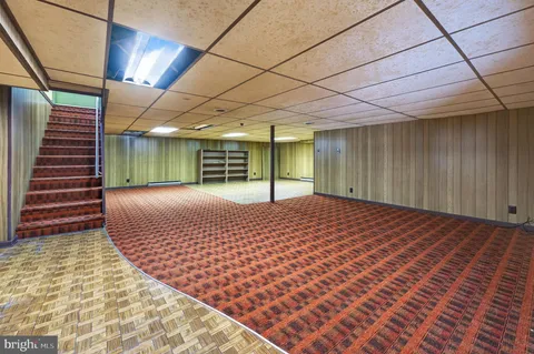 a bedroom with a bed and a chair