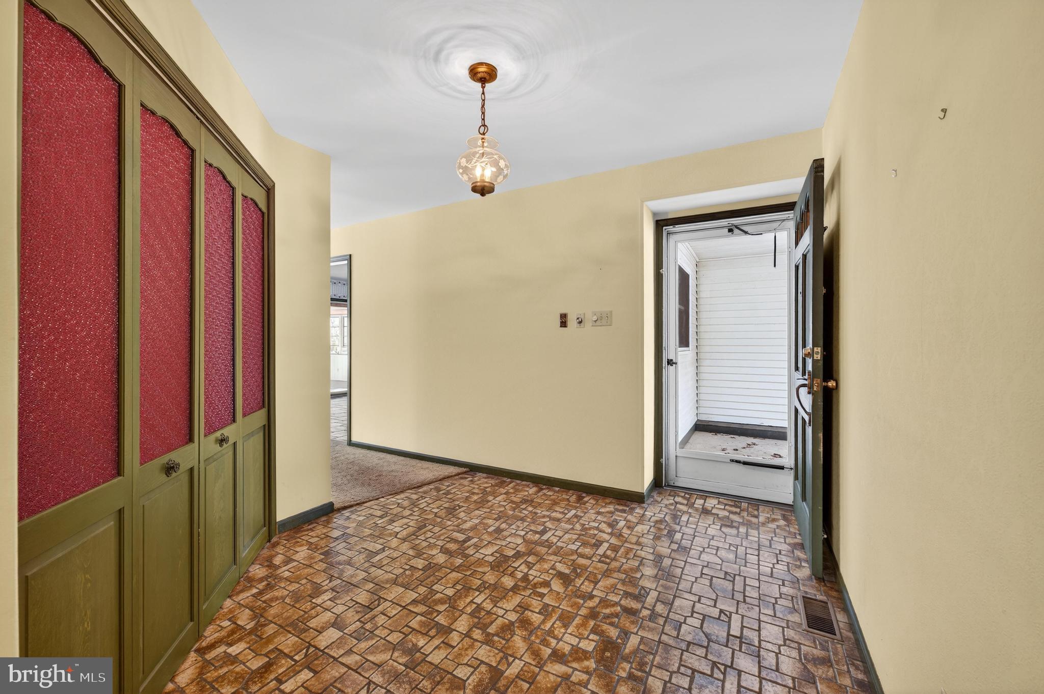 425 Stokes Road Shamong, NJ 08088 - Photo 3 of 35 a view of a hallway with wooden floor and a bathroom