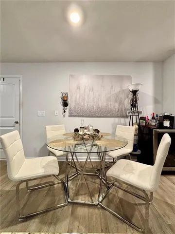 a living room with furniture and a ceiling fan