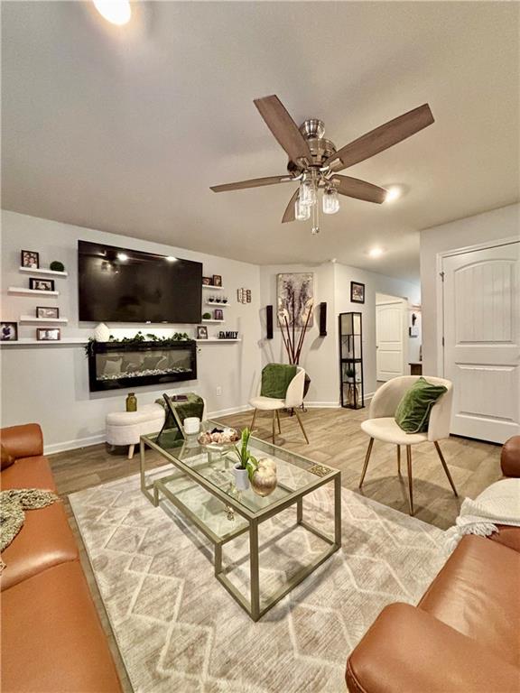 1367 Midnight Ride Drive Hampton, GA 30228 - Photo 12 of 62 a living room with furniture and a flat screen tv