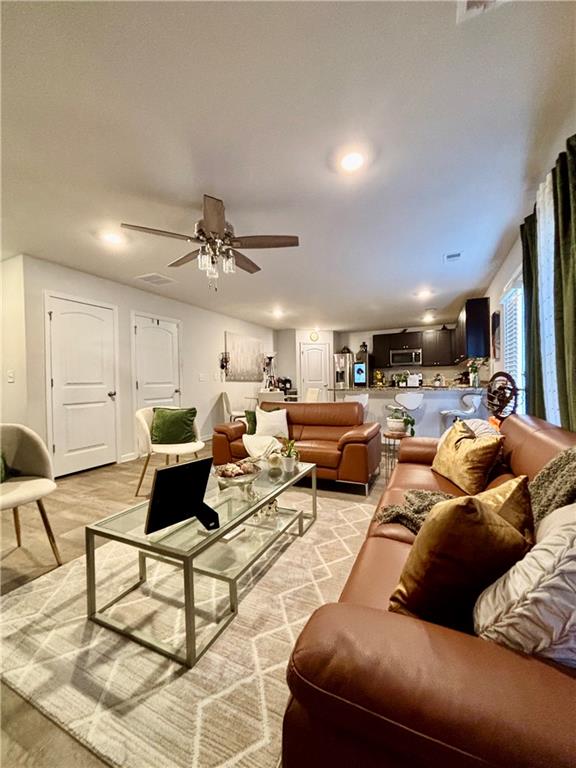 1367 Midnight Ride Drive Hampton, GA 30228 - Photo 13 of 62 a living room with furniture and a ceiling fan
