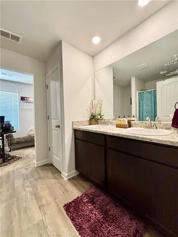 a bedroom with furniture and a rug