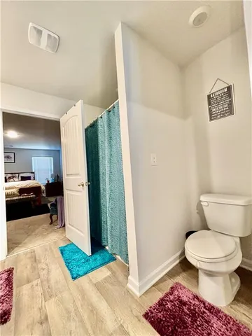 a en suite bathroom with a sink and a mirror
