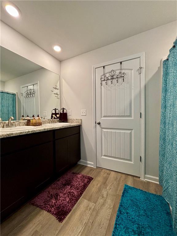 1367 Midnight Ride Drive Hampton, GA 30228 - Photo 26 of 62 a en suite bathroom with a sink and a mirror
