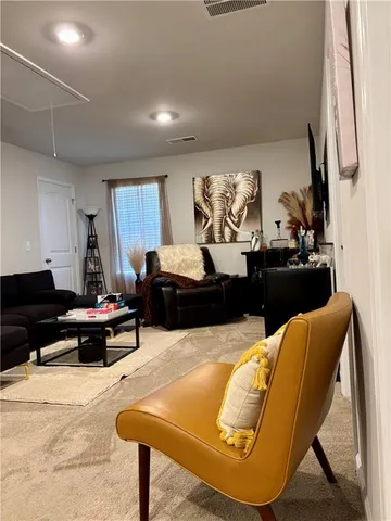 a bedroom with a bed and wall painting