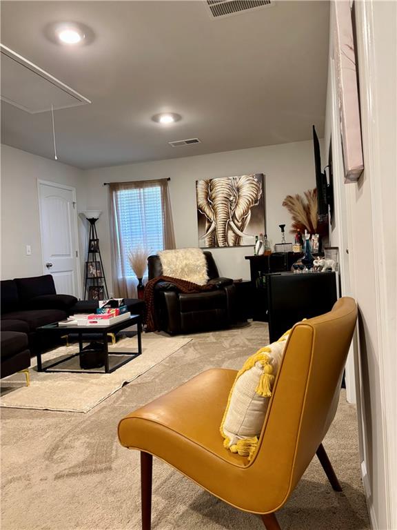 1367 Midnight Ride Drive Hampton, GA 30228 - Photo 29 of 62 a living room with furniture and a flat screen tv
