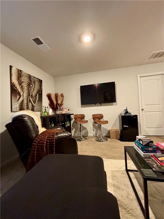 1367 Midnight Ride Drive Hampton, GA 30228 - Photo 31 of 62 a living room with furniture and a flat screen tv