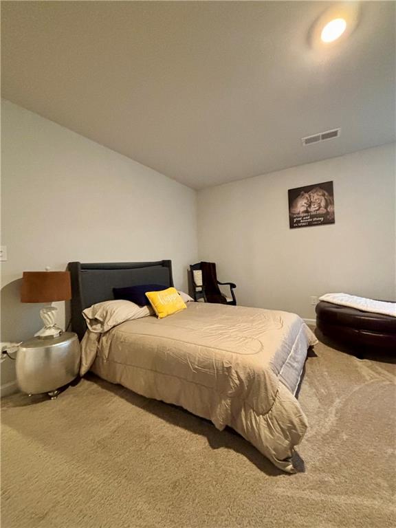 1367 Midnight Ride Drive Hampton, GA 30228 - Photo 33 of 62 a bedroom with bed and window