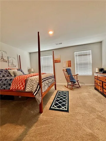 a bedroom with furniture and a couch