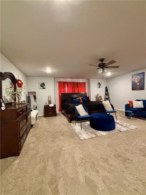 1367 Midnight Ride Drive Hampton, GA 30228 - Photo 47 of 62 a living room with furniture and a flat screen tv