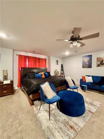 a bedroom with a bed and a desk