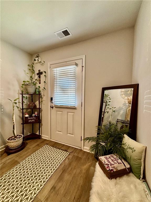 1367 Midnight Ride Drive Hampton, GA 30228 - Photo 5 of 62 a bedroom with a bed and wooden floor