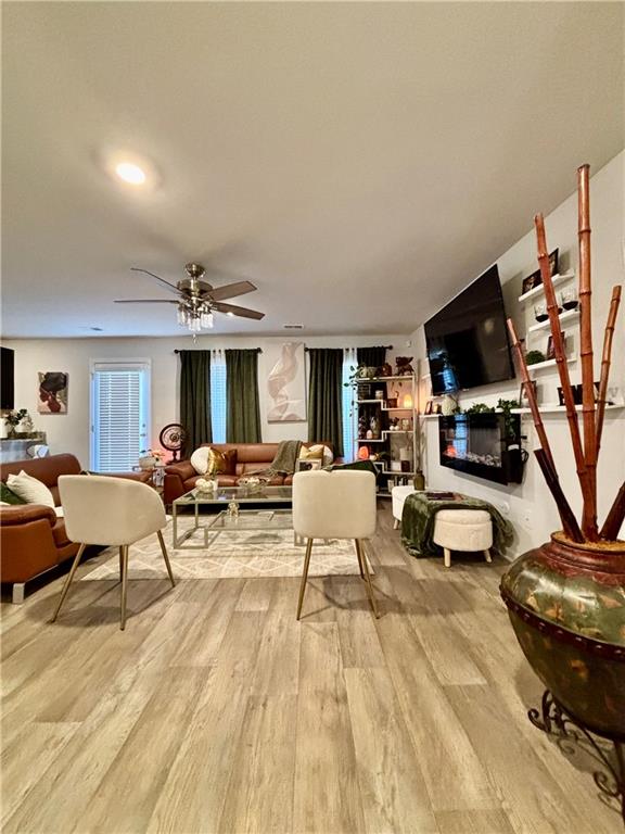1367 Midnight Ride Drive Hampton, GA 30228 - Photo 6 of 62 a living room with furniture and a flat screen tv