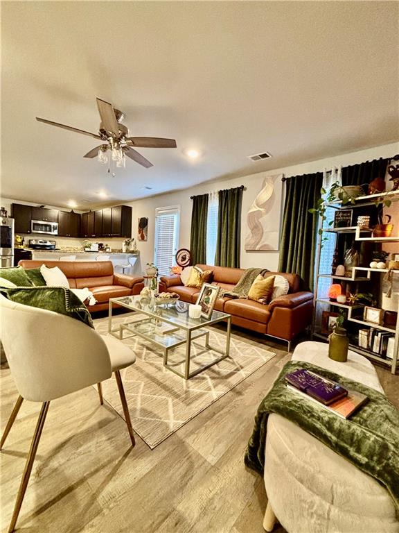 1367 Midnight Ride Drive Hampton, GA 30228 - Photo 7 of 62 a living room with lots of furniture and kitchen view