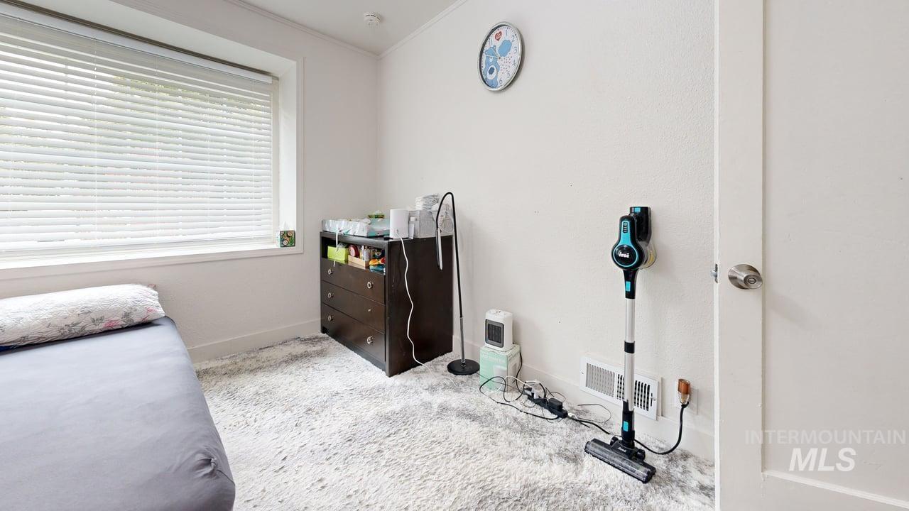 1210 10th Street Lewiston, ID 83501 - Photo 13 of 25 Bedroom with carpet and crown molding