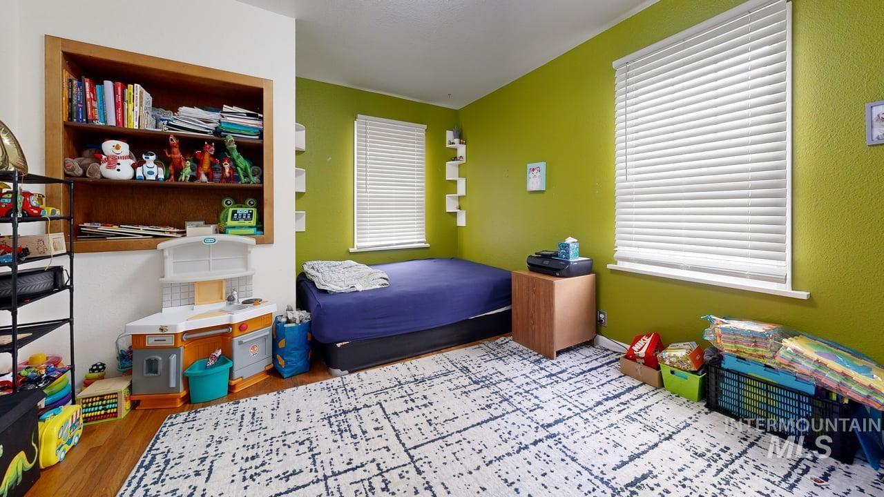 1210 10th Street Lewiston, ID 83501 - Photo 14 of 25 Bedroom with wood finished floors and baseboards