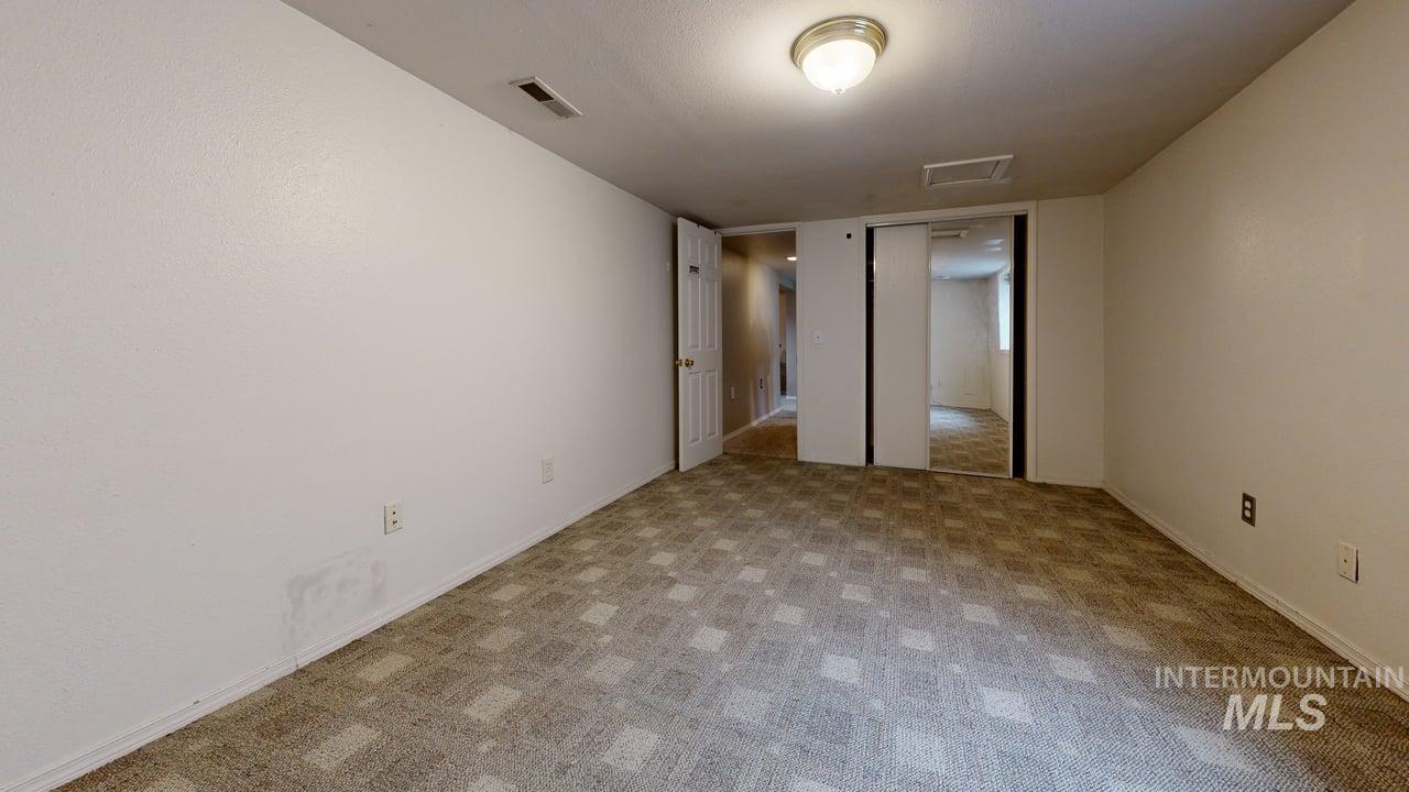 1210 10th Street Lewiston, ID 83501 - Photo 24 of 25 Unfurnished bedroom with carpet flooring and baseboards