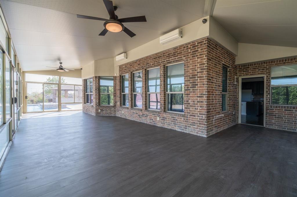 303 San Marcos Drive Irving, TX 75039 - Photo 25 of 33 a view of an empty room with window and wooden floor