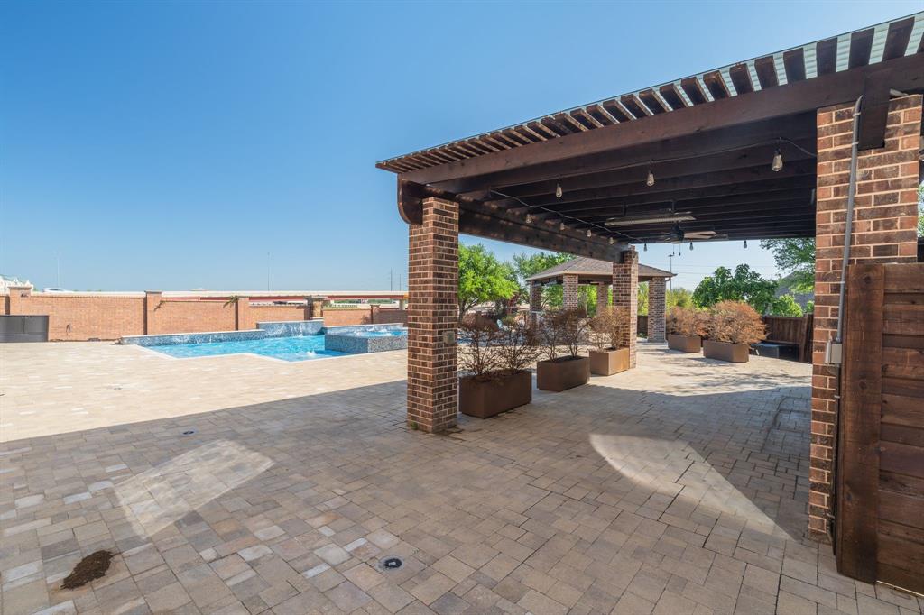 303 San Marcos Drive Irving, TX 75039 - Photo 30 of 33 a view of a porch with furniture and a garage
