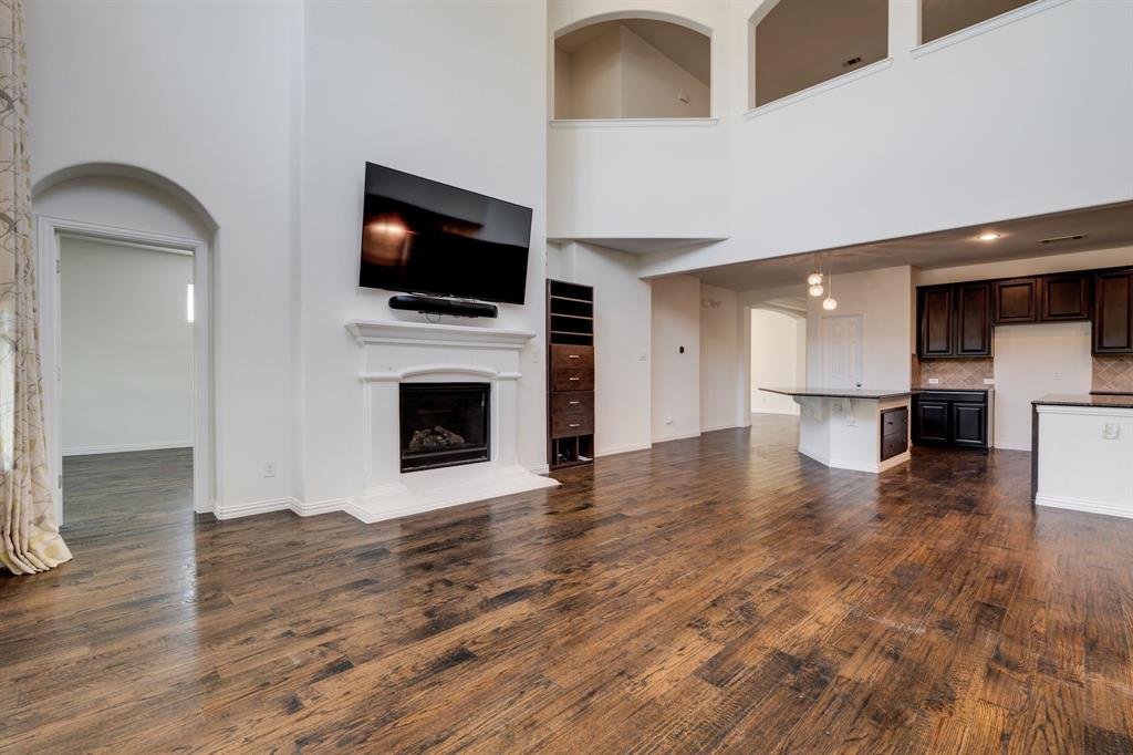 303 San Marcos Drive Irving, TX 75039 - Photo 5 of 33 a view of a living room a flat screen tv and kitchen view