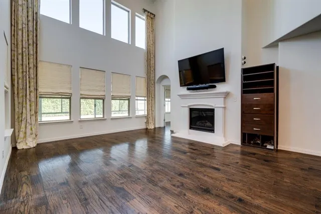 a view of a livingroom with a flat screen tv and entryway