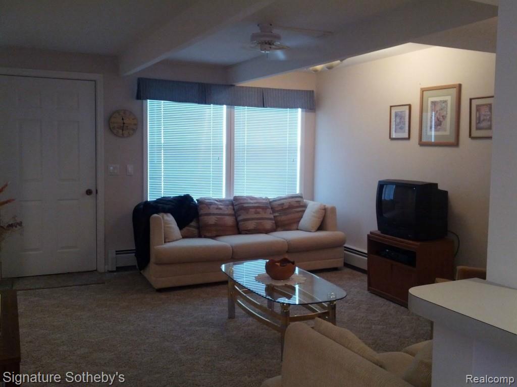 13456 Stover Road, Unit 3 Charlevoix, MI 49720 - Photo 7 of 16 Spacious Living Room with access to deck.