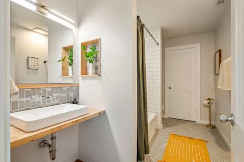 a bathroom with a sink and a mirror