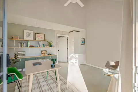 a living room with furniture and a table