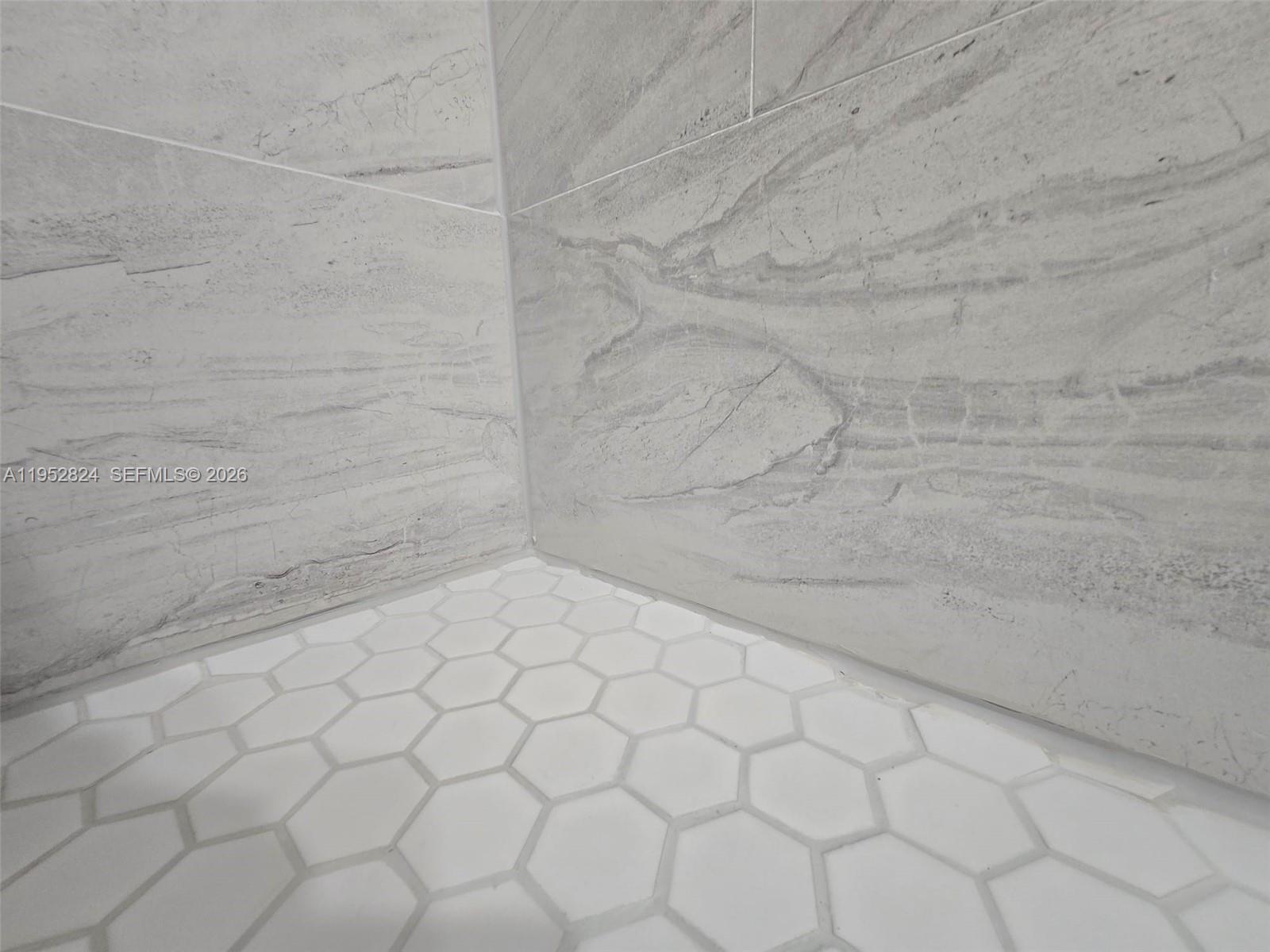 10090 Northwest 80th Court, Unit 1155 Hialeah Gardens, FL 33016 - Photo 13 of 19 a bathroom with a white toilet