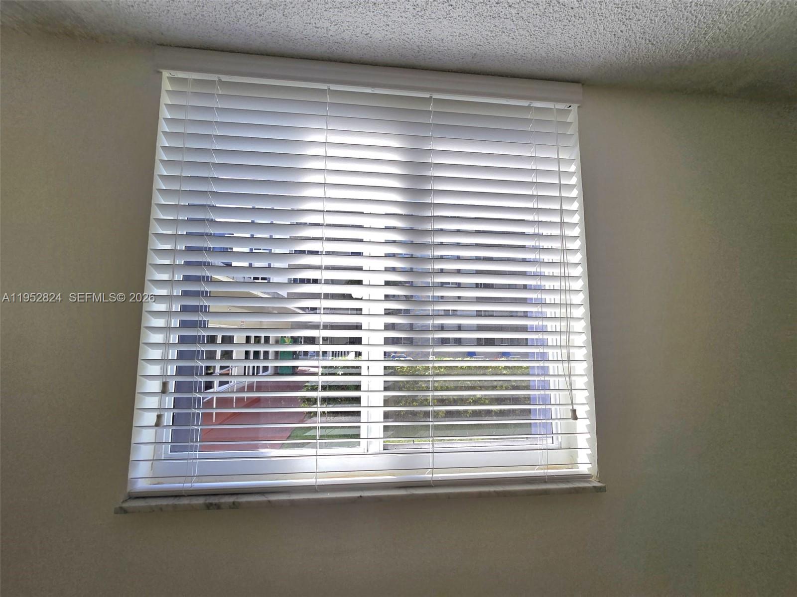 10090 Northwest 80th Court, Unit 1155 Hialeah Gardens, FL 33016 - Photo 16 of 19 a view of a window in a room